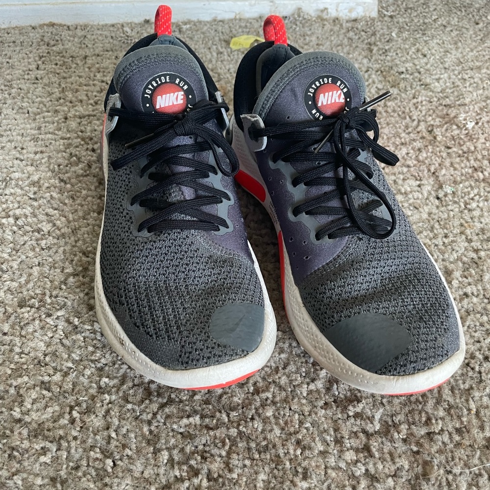 Gray Nike women shoes size 9 with bright orange trim